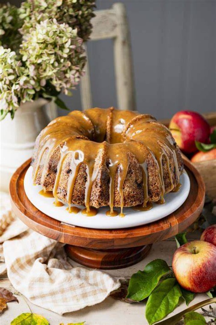 Apple bundt cake on a white platter.