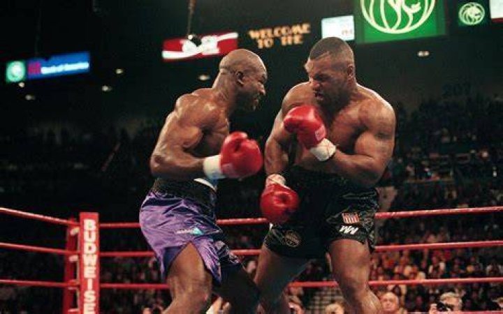 Evander Holyfield with Mike Tyson.